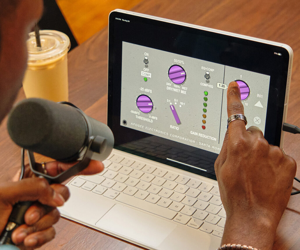 Man using laptop touch screen to use Symphony ECS Channel Strip